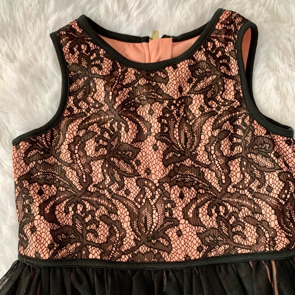 Beautiful lace and tulle dress with lining.